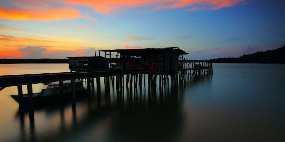 Brown Wooden House on Top of Sea