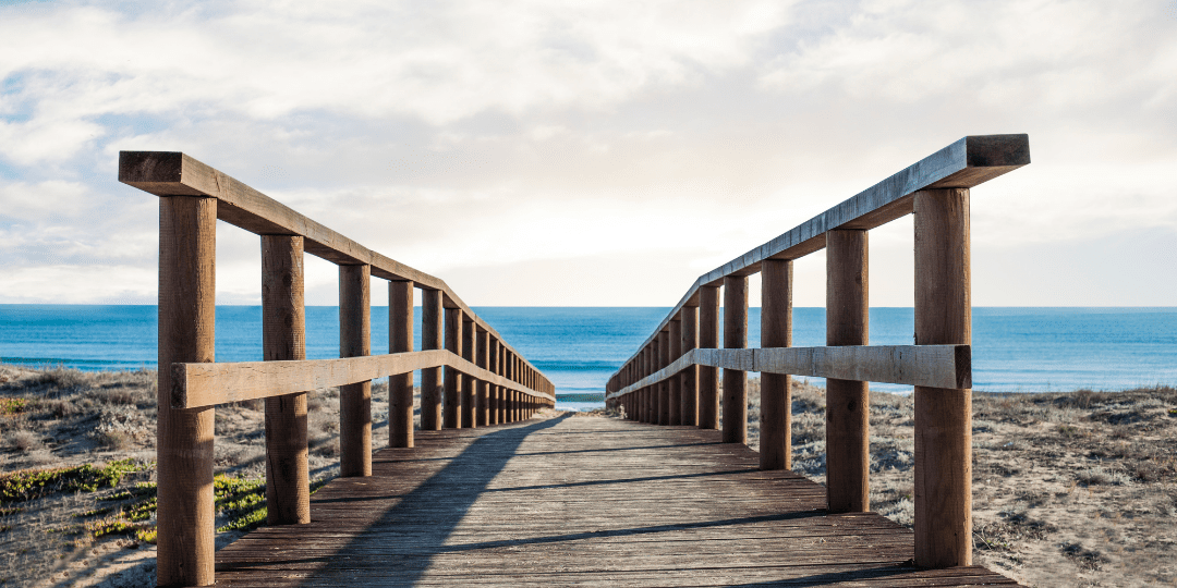 wooden footbridge over the sand wooden footbridge over the sand